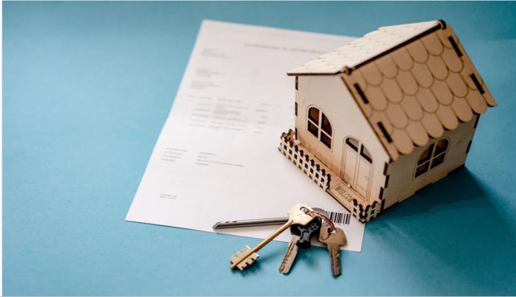 Real Estate papers with keys