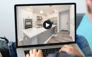 real estate video marketer working with his laptop