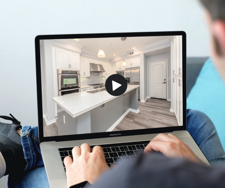 real estate video marketer working with his laptop