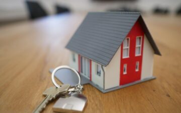toy house on a table with a key