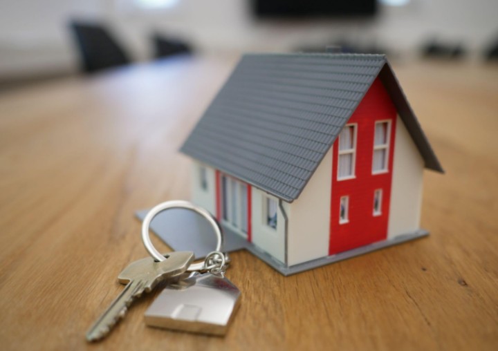 toy house on a table with a key