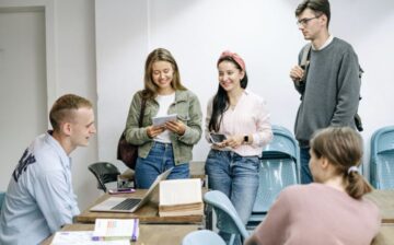 group of people standing and talking