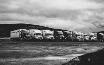moving trucks standing on line