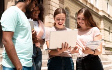 group of students with a computer
