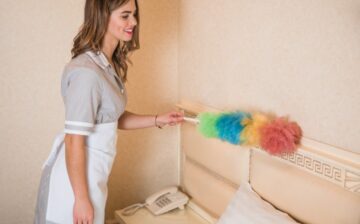 woman passing duster