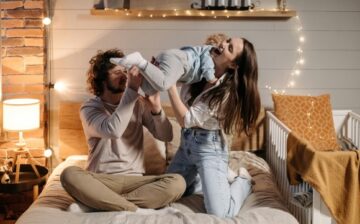 a couple holding a new born baby