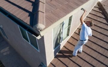 painter painting exterior of a home